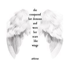 two white wings with the words, she conquer her demons and wore her scars like wings