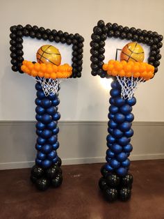 two basketball themed balloons in the shape of hoops