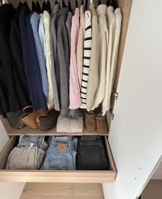 the closet is full of clothes and shoes