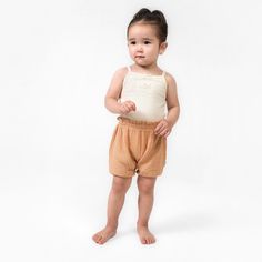 Elevate your child's summer wardrobe with this three pack of baby girl shorts. Made from a lightweight cotton gauze that’s gentle on sensitive skin, these shorts feature a comfort-stretch waistband for an easy fit. These shorts are perfect for those sunny days, ensuring your little one stays cool during outdoor activities and adventures. With a range of colors in this collection, you can effortlessly mix and match various outfits, making them a versatile addition to your child's clothing assortment. And for convenient care throughout the season, just pop them in the washing machine or dryer as needed. Our essentials have been independently certified with STANDARD 100 by OEKO-TEX® so that you don’t have to worry about harmful substances in your baby’s wardrobe. Pack includes three shorts. | Cute Short Diaper Cover For The Beach, Cute Short Diaper Cover For Beach, Playful Short Diaper Cover For Playwear, Cute Short Diaper Cover For Summer, Cute Short Summer Diaper Cover, Cute Summer Short Diaper Cover, Summer Beach Diaper Cover Shorts, Summer Beach Diaper Cover In Short Style, Short Summer Beach Diaper Cover