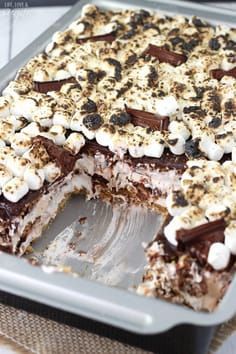 a cake with marshmallows and chocolate on top