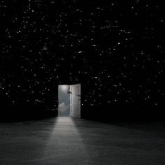 an open door in the middle of a dark room with stars on the sky above