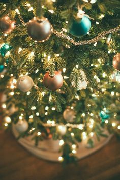 a christmas tree with ornaments and lights on it