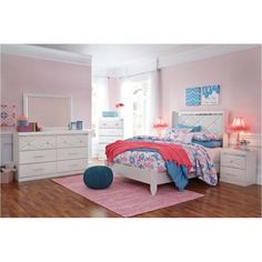 a bedroom with pink walls and white furniture