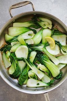 the vegetables are being cooked in the pan