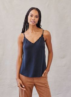 Our frayed cami is a perfect everyday versatile top. It features adjustable straps, a frayed neckline, and relaxed fit. It is an essential and perfect layering piece. Pair with jeans tucked in or untucked for a more effortless look. Made with luxuriously soft and eco-friendly TENCEL™ lyocell. Imported 100% TENCEL™ Lyocell Machine wash cold Adjustable straps Relaxed fit B2243-654-303 Bella Dahl, Cami Tanks, Layering Pieces, Polished Look, Vintage Black, Camisole Top, Everyday Essentials Products, Color Coding, Relaxed Fit