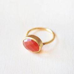 18K Gold ring with a authentic red carnelian gemstone oval shaped inside. Unique handmade ring available in different sizes. Is a handcrafted design with a authentic natural gemstone inside. Available in different gems: rose quartz, amethyst, green onyx, lapis lazuli, carnelian and aqua chalcedony. Perfect for any occasion or event. Also perfect as a lovely gift. You will receive packed into a lovely jewelry box and nice cotton pouch. > Gemstone properties: Apart from its beautiful appearance Oval Carnelian Orange Ring, Red Carnelian Ring As A Gift, Red Carnelian Cabochon Ruby Ring, Carnelian Cabochon Ruby Ring, Oval Orange Carnelian Rings, Orange Oval Carnelian Rings, Red Moonstone Gemstone Ring As Gift, Red Carnelian Oval Cabochon Ruby Ring, Carnelian Ruby Ring With Oval Cabochon For Gift