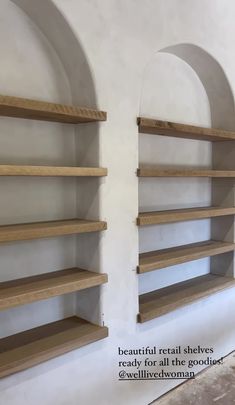 two wooden shelves are lined up against the wall, one is empty and the other is closed