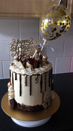 a birthday cake decorated with champagne and confetti