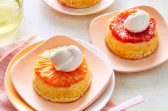 two small plates with pastries on them