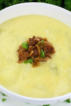 a white bowl filled with soup on top of a table