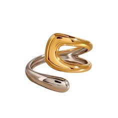 The Dani Ring features a unique duo chrome design, blending stainless steel with gold plating, for a stylish and hypoallergenic ring that is also waterproof. Trendy Gold Stainless Steel Rings, Modern Metal Midi Rings Tarnish Resistant, Trendy Polished Gold Rings, Trendy Gold Rings With Polished Finish, Modern Gold Couple Rings Tarnish Resistant, Modern Gold Wide Band Metal Ring, Modern Gold Metal Midi Rings, Modern Gold Open Couple Rings, Modern Twist Gold Metal Rings