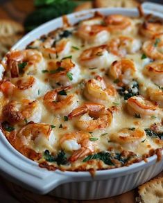 a casserole dish filled with shrimp and cheese