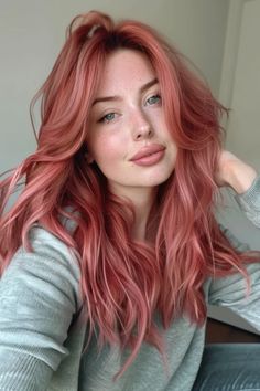 Soft curls in a light strawberry red shade. Ion Rose Quartz Hair Color, Peach Pink Ombre Hair, Pinky Red Hair Colour, Colors That Go With Blonde Hair, Strawberry Color Hair, Rose Gold Hair Pale Skin, Cool Toned Colored Hair, Red Hair Pink Undertones, Lightly Colored Hair