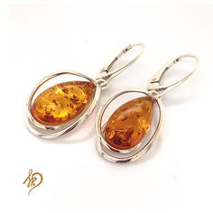 Beautiful and unique Earrings with Baltic Amber. These earrings are made of sterling silver 925 and one and only Baltic Amber from Poland. Amber in earrings all are very unique - there are small chances that You can find exactly the same earrings. Special jewels for special ladies! Amber cabochons are available in different colors (cognac, green). Amber is a very special stone and each of them could look little bit different from another - what is definitely its advantage. I tried to pick 2 the Anniversary Polished Dangle Earrings, Anniversary Dangle Earrings With Polished Finish, Amber Teardrop Sterling Silver Jewelry, Sterling Silver Earrings With Polished Finish For Anniversary, Sterling Silver Polished Earrings For Anniversary, Sterling Silver Polished Anniversary Earrings, Sterling Silver Oval Earrings With Ear Wire, Unique Round Earrings With Polished Finish, Polished Sterling Silver Earrings