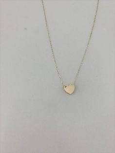 14k Solid Gold Heart Necklace, Bold Heart 14k Gold, Hollow Heart, Bold Hollow Gold Heart, Dainty Necklace, Layering Necklace, Gold Heart Necklace ------------------------------------------------------------------------------------------------ The Heart Necklace is a beautiful, affordable dainty 14K Solid Gold piece of jewelry that is great for everyday wear. It comes available just in yellow gold. This necklace can be used in combination any of our other necklaces for a layering effect. A great 14k Gold Heart Pendant Necklace With Adjustable Chain, 14k Gold Heart Charm Necklaces With Adjustable Chain, 14k Gold Heart Charm Necklace With Adjustable Chain, 14k Gold Heart Necklace With Adjustable Chain, 14k Gold Heart Cut Necklace With Adjustable Chain, 14k Rose Gold Heart Pendant Necklace, Rose Gold 14k Heart Pendant Necklace, 14k Gold Necklace With Heart Charm And Cut, Rose Gold Heart Charm Necklace In 14k Gold