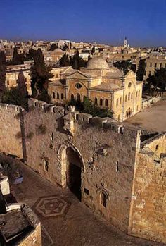 an aerial view of the old city and its surrounding buildings, including two archways