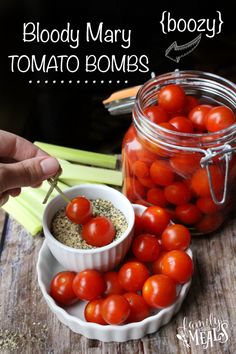 tomatoes and celery are in small bowls next to a jar of tomatos