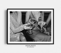 black and white photograph of three people holding wine glasses in their hands, with the caption arbor prests art collective