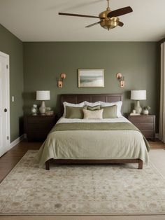 a bedroom with green walls and white bedding