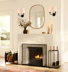 a living room with a fire place and mirror