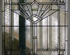 a stained glass window with an abstract design