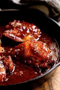 some meatballs and sauce in a pan on a table