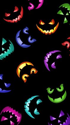 an image of halloween pumpkin faces on black background