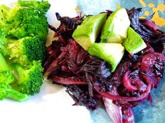 broccoli, onions and avocado on a plate