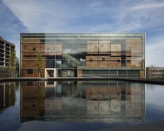 an image of a building that is reflecting in the water