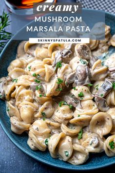 creamy mushroom masala pasta on a blue plate