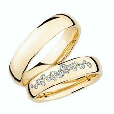 two gold wedding rings with diamonds on them