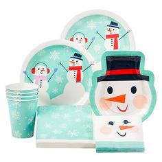 a snowman themed tableware set with cups, plates and napkins on it