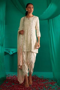 Ivory kurta with all over sequin, thread embroidery. Paired with a draped dhoti pant and peach dupatta. - Aza Fashions Chinon Sherwani With Mirror Work For Festive Occasion, Eid Chanderi Salwar Kameez With Sequins, Eid Georgette Sherwani With Traditional Drape, Eid Sherwani In Traditional Drape Georgette, Eid Traditional Drape Georgette Sherwani, Eid Sequined Raw Silk Dupatta, Sequined Salwar Kameez For Eid, Bollywood Style Georgette Sherwani For Diwali, Designer Salwar Kameez With Sequins And Traditional Drape