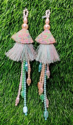 Indian Handmade Light pink multi Beaded Latkan Tassels for Saree Blouse HandBags Dupatta Bridal Wedding dress for Women pair of 2 pcs Size - 19.0 cm Length  Item Description You can use this Beautiful pair of tassle for several DIY projects.  *These beautiful Tassel Latkans are used as the accessory for saree blouse on the back, but u can use according to your need and your innovative ideas. * Package contains 2 Latkan / 1 Pair Other Than Saree Blouse, you can use these latkans in various ways Craft Projects Designing Home Decoration Festive celebrations. Evening and party Apparels. Home décor items Apparel & Fashion Scarves n Stoles Headband, hats Table cover, curtains, Pillow covers, Cushion cover Shoe designing Headband, hats Table cover, curtains Designing stylish blouses Ship From New Tassels For Saree, Latkan Tassels, Dupatta Bridal, Wedding Dress For Women, Stylish Blouses, Bridal Wedding Dress, Fashion Scarves, Innovative Ideas, Handmade Lighting