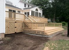 a wooden deck with steps leading up to it