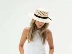 *FINAL SALE* The Daisy Hat by Freya is a classic bolero hat crafted in woven straw with a vented daisy pattern, finished with black grosgrain ribbon. Each hat is unique and reflects the natural beauty & variation of the handicraft process 8cm brim UPF 50 Made in Ecuador Small/Medium (55 cm - 57 cm) Fitted Woven Straw Hat For Spring, Spring Fitted Woven Straw Hat, Classic Woven Straw Hat For Spring, Woven Straw Hat With Short Brim For Spring, Spring Woven Straw Hat With Short Brim, Spring Woven Short Brim Panama Hat, Spring Woven Panama Hat With Short Brim, Spring Adjustable Natural Boater Hat, Chic Spring Woven Panama Hat