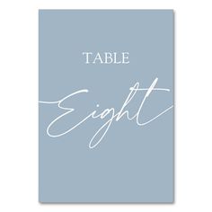 a table sign with the words,'table eight'written in white on a blue background