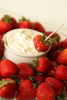 some strawberries and dip on a plate