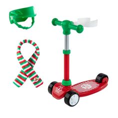 a red scooter with green wheels and a christmas ribbon on the handlebars