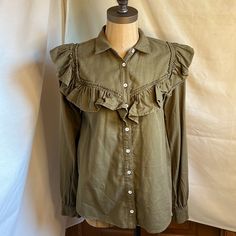 Nwt Anthropologie Size Xs Olive Green Long Sleeve Shirt Details Long Sleeve Button Down Shirt With Collar Ruffles At Shoulders And Front Of Shirt Fabric 100% Cotton Approximate Measurements Pit To Pit 17” Length Of Sleeve 18.5” Length 23.5” Collared Khaki Tops For Day Out, Khaki Fitted Button-up Top, Khaki Collared Top For Day Out, Chic Collared Khaki Top, Khaki Collared Cotton Blouse, Collared Cotton Blouse In Khaki, Casual Cotton Shirt With Ruffles, Khaki Tops With Button Closure For Day Out, Khaki Cotton Collared Blouse