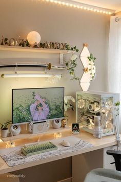 a computer monitor sitting on top of a desk next to a keyboard, mouse and other items