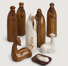 a group of ceramic figurines sitting next to each other