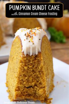 a pumpkin bundt cake with cinnamon cream cheese frosting on a white plate next to other desserts