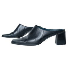 Features pointed toe and wide heel design Pointed Toe Mules With 4-inch Heel, Modern Mules With Pointed Toe, Medium Width, Pointed Toe Mules With 4-inch Heel Medium Width, Sleek Synthetic Mules With 4-inch Heel, Modern Black Mules With 4-inch Heel, Corset Shirt, Heel Design, Heeled Mules Sandals, Wide Heels