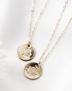 · 1/2" (12.7mm) disc· 14k yellow gold fill, 14k rose gold fill, and sterling silver options· Sturdy, timeless, and built to be worn everydayOur classic 1/2” necklaces are easy to layer, elegant, and ready to be personalized with your most special sentiments, moments, and memories! Created to last a lifetime, these necklaces will remain evergreen even as the years and trends come and go.Personalizing your piece with a message? Reference our fonts and symbols chart for font options and character m Dainty Nickel-free Medallion Jewelry, Everyday Birth Flower Charm Necklaces, Everyday Birth Flower Charm Necklace, Delicate 14k Gold Filled Engraved Necklaces, Minimalist Medallion Jewelry For Everyday, Delicate Engraved 14k Gold Filled Necklaces, Delicate Engraved 14k Gold-filled Necklaces, Everyday 14k Gold Medallion Charm Necklace, Everyday Gold Sterling Silver Coin Necklace