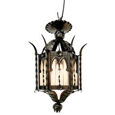 an old fashioned hanging light with horns on the front and back end, against a white background