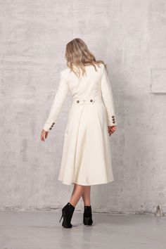 "Off White Fit and Flare Coat, Slim Elegant Coat, Winter Dress Coat I took a classic long cashmere wool women's coat design and turned it into a gorgeous princess silhouette dress coat that will impress even the strictest of critics. This handcrafted fitted ivory coat is a double-breasted construction topped with a lapel collar and long sleeves. 🌀 IMPORTANT: --Please keep in mind that ivory is a custom color. To get this color, you need to purchase this listing https://www.etsy.com/listing/8493 Winter Wedding Coat, Long White Coat, White Wool Coat, Fit And Flare Coat, White Winter Coat, Winter Coat Dress, Cream Coat, Princess Coat, Elegant Coats