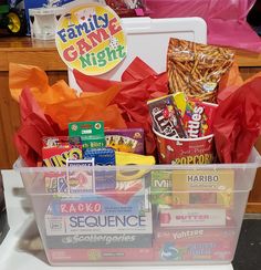 a plastic container filled with candy and snacks