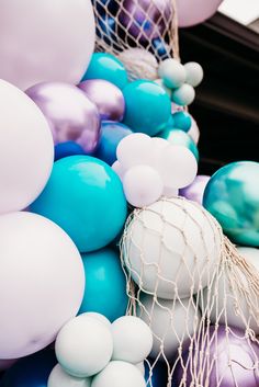 there are many balloons that are tied together